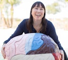 Lynette Louise holding a large model brain
